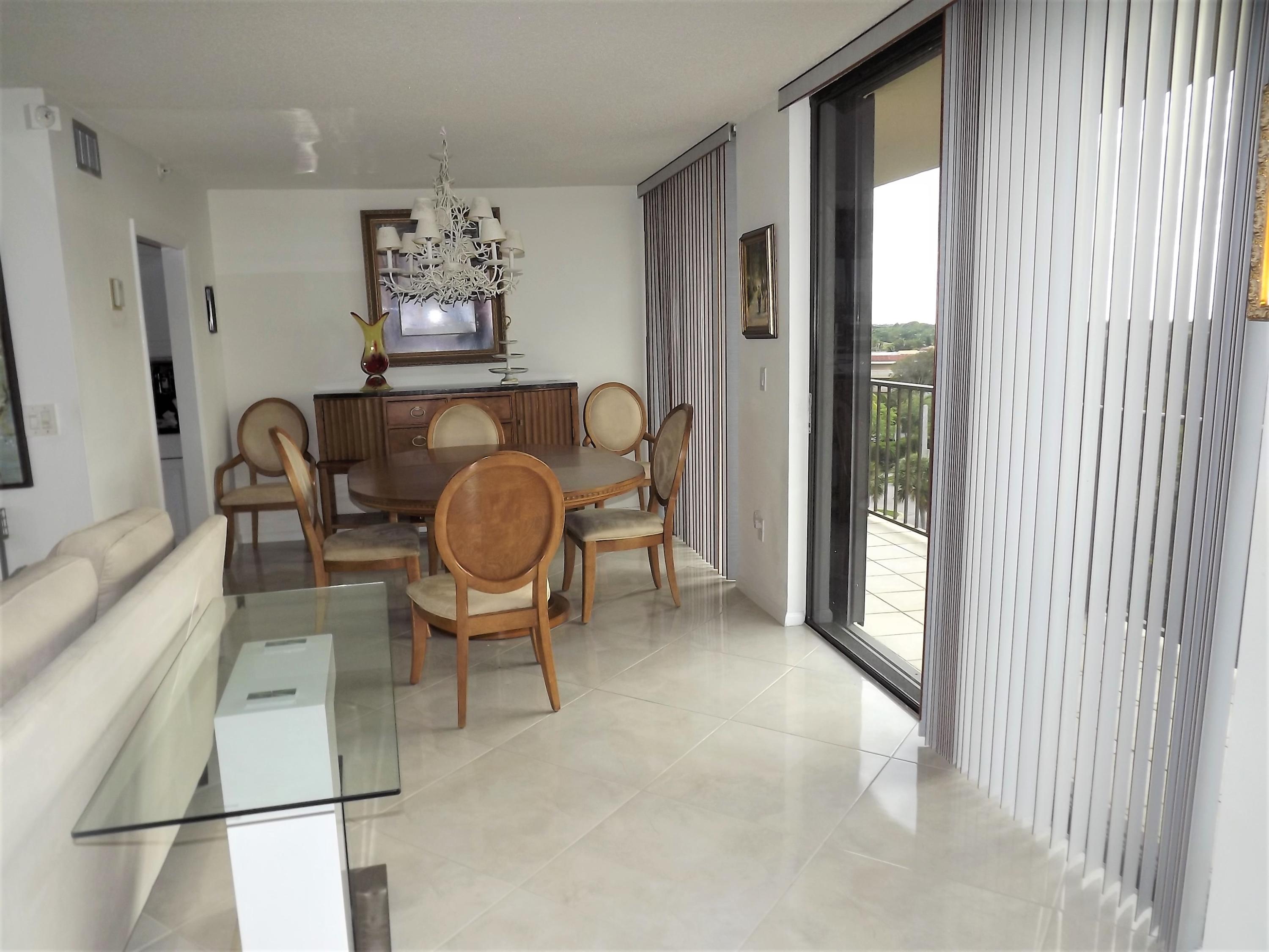 859 Jeffery Street, Unit 702 Boca Raton, FL 33487 - Photo 16 of 40 a view of a livingroom with furniture and a large window