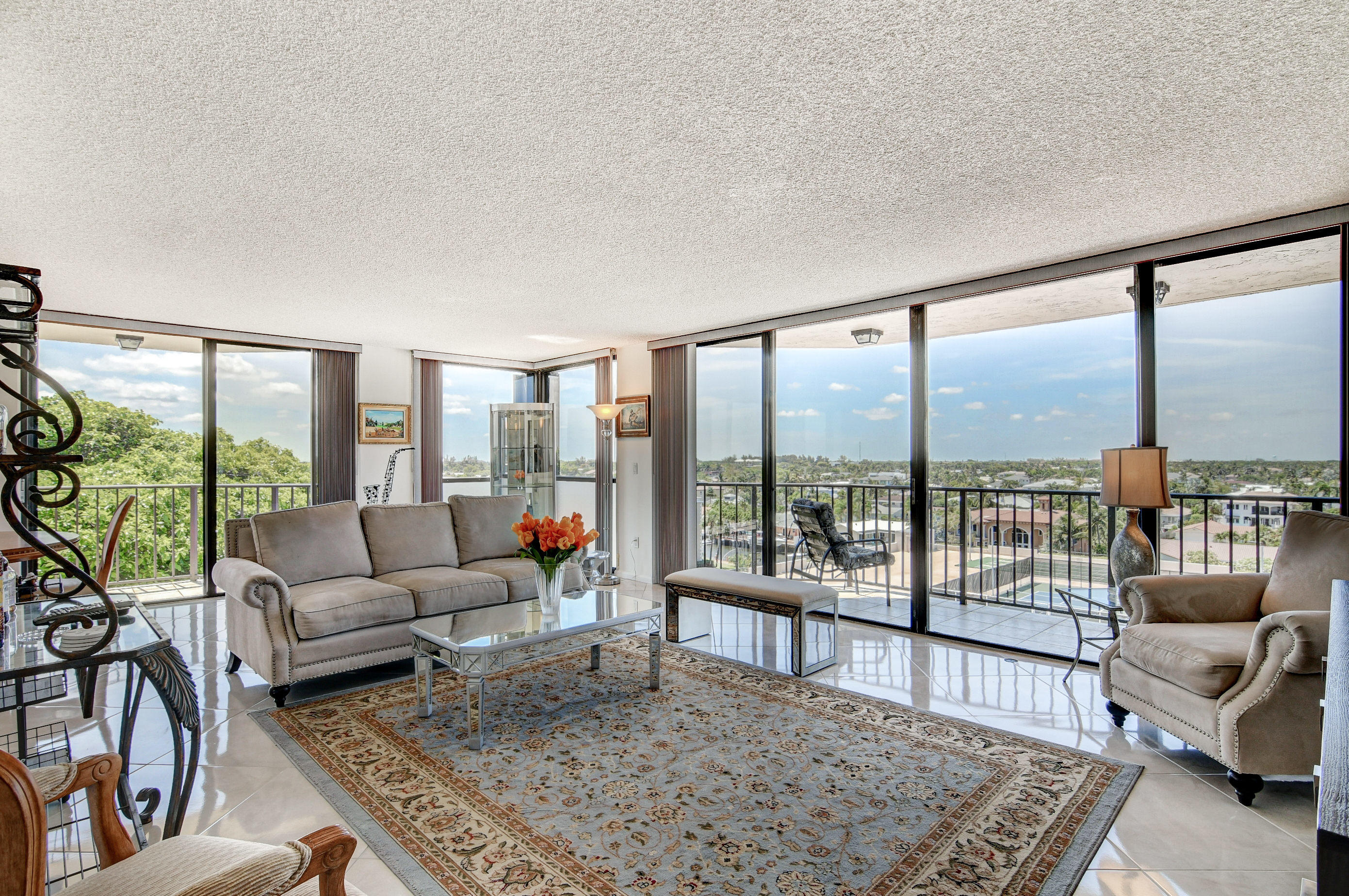 859 Jeffery Street, Unit 702 Boca Raton, FL 33487 - Photo 2 of 40 a living room with furniture and a rug