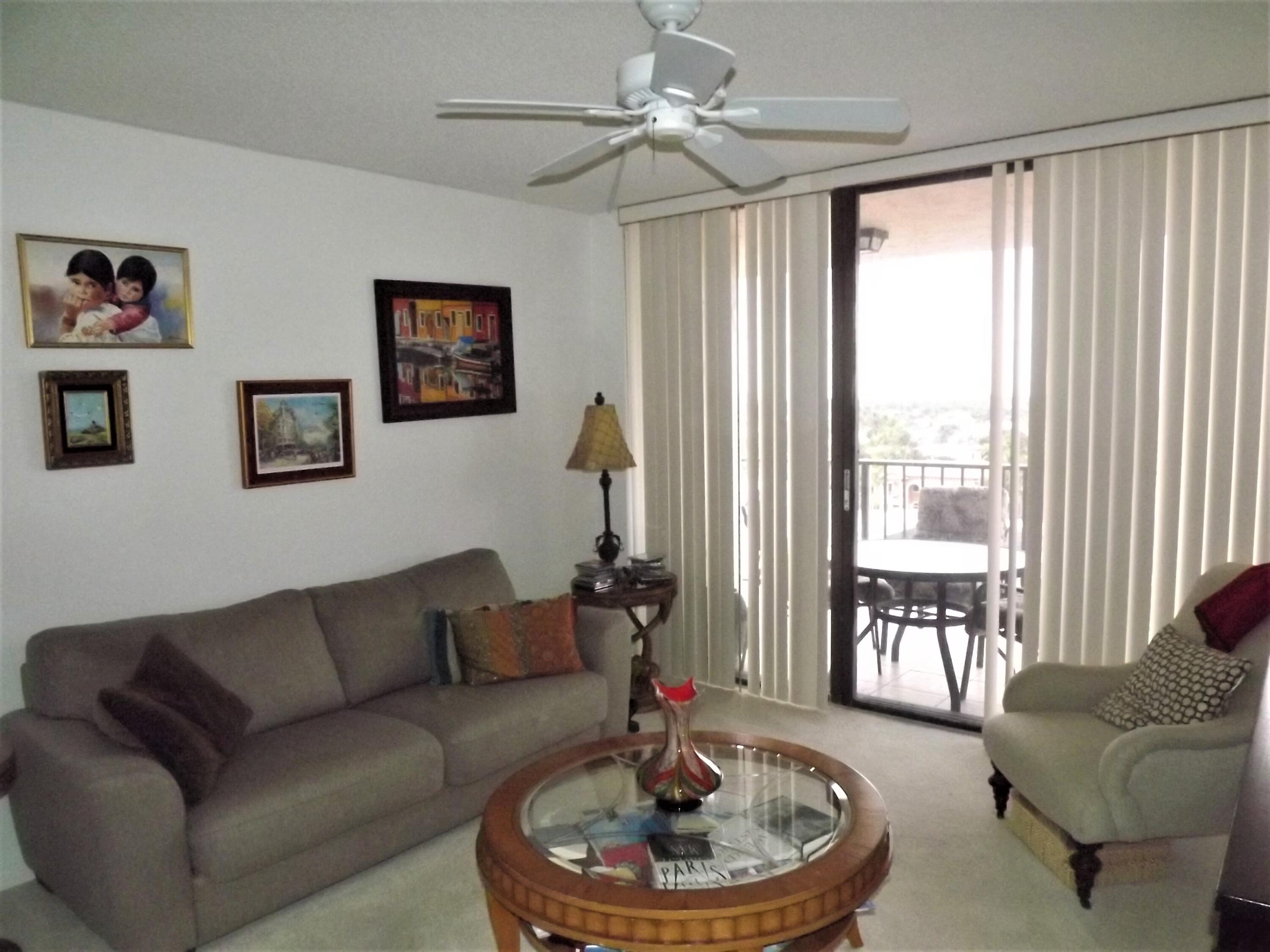 859 Jeffery Street, Unit 702 Boca Raton, FL 33487 - Photo 24 of 40 a living room with furniture and a large window