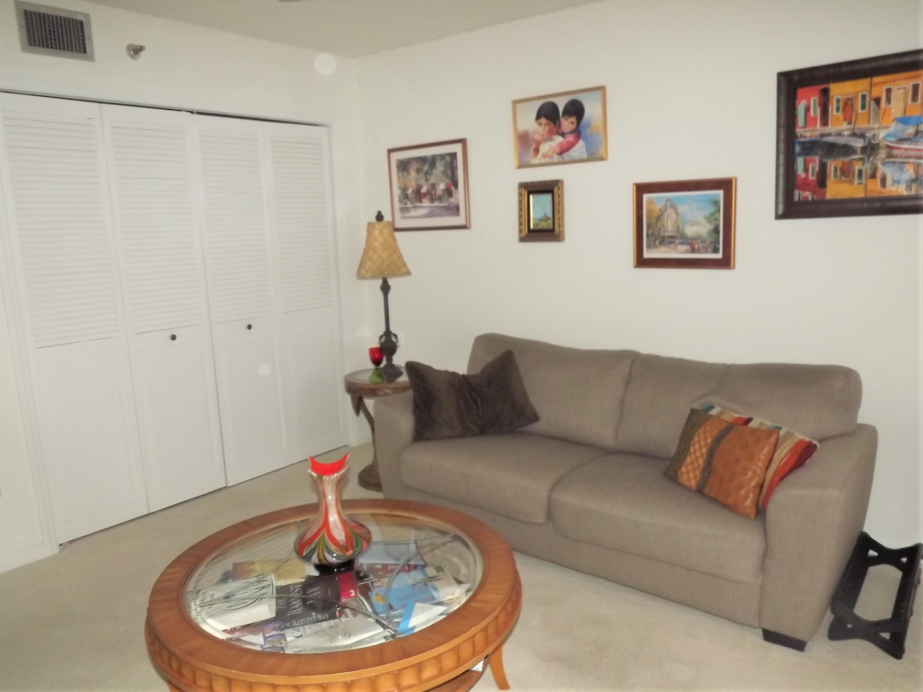 859 Jeffery Street, Unit 702 Boca Raton, FL 33487 - Photo 25 of 40 a living room with furniture and a wooden floor