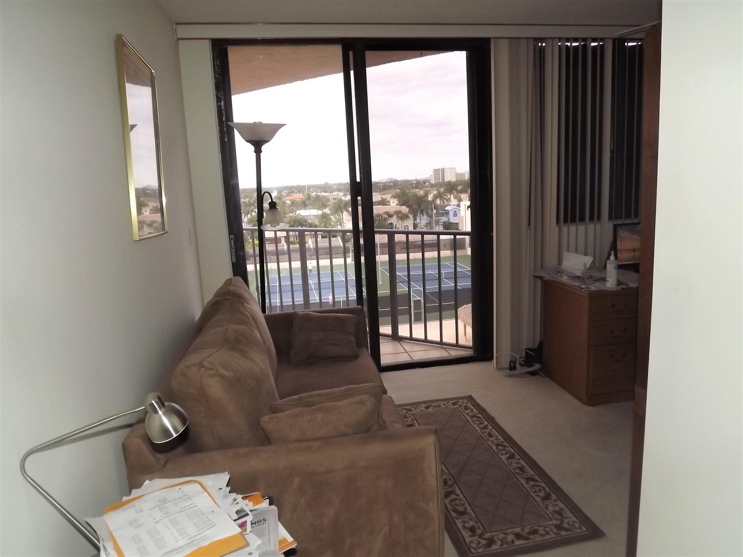 859 Jeffery Street, Unit 702 Boca Raton, FL 33487 - Photo 26 of 40 a living room with furniture and a floor to ceiling window