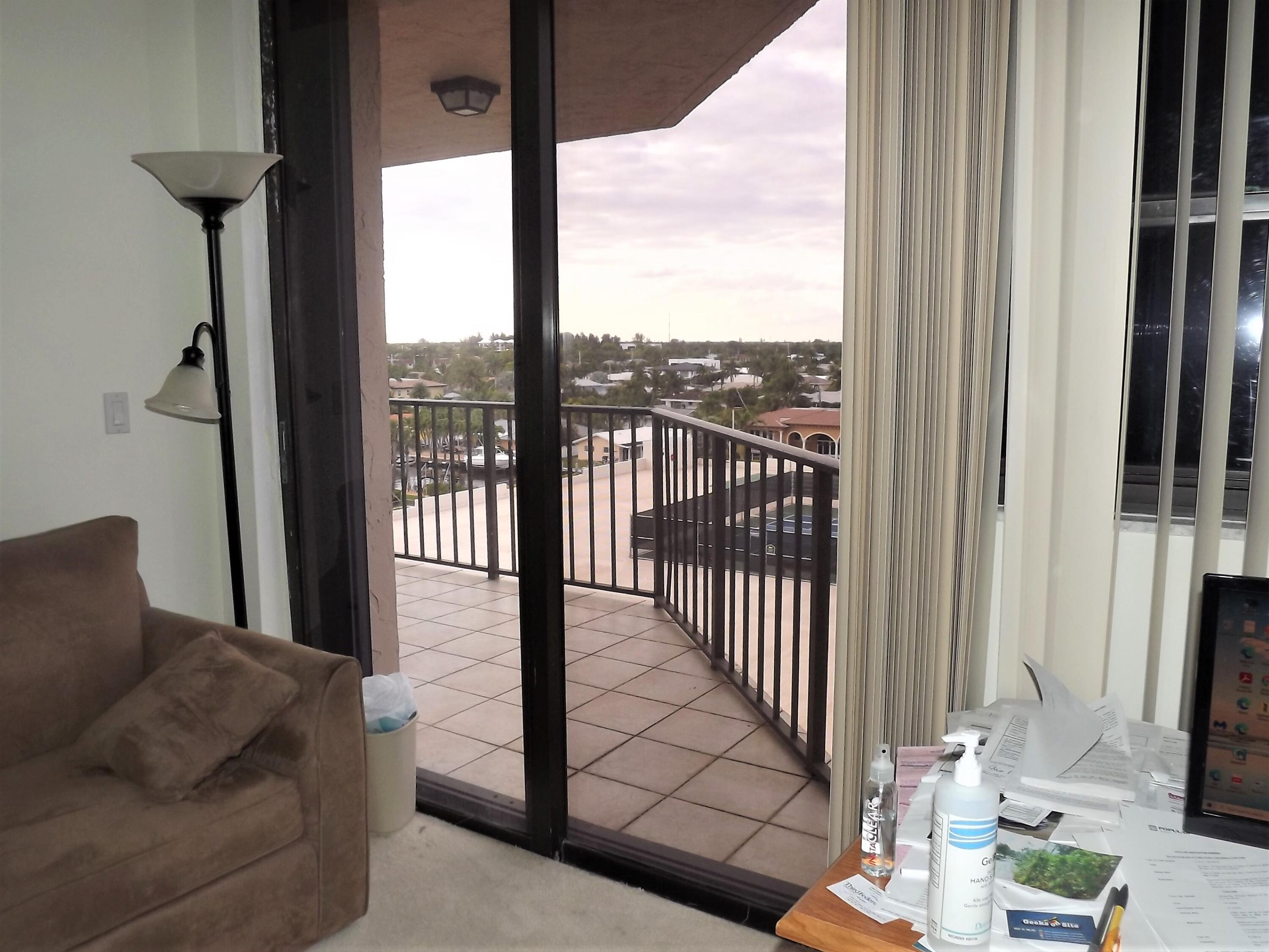 859 Jeffery Street, Unit 702 Boca Raton, FL 33487 - Photo 27 of 40 a living room with furniture and a floor to ceiling window