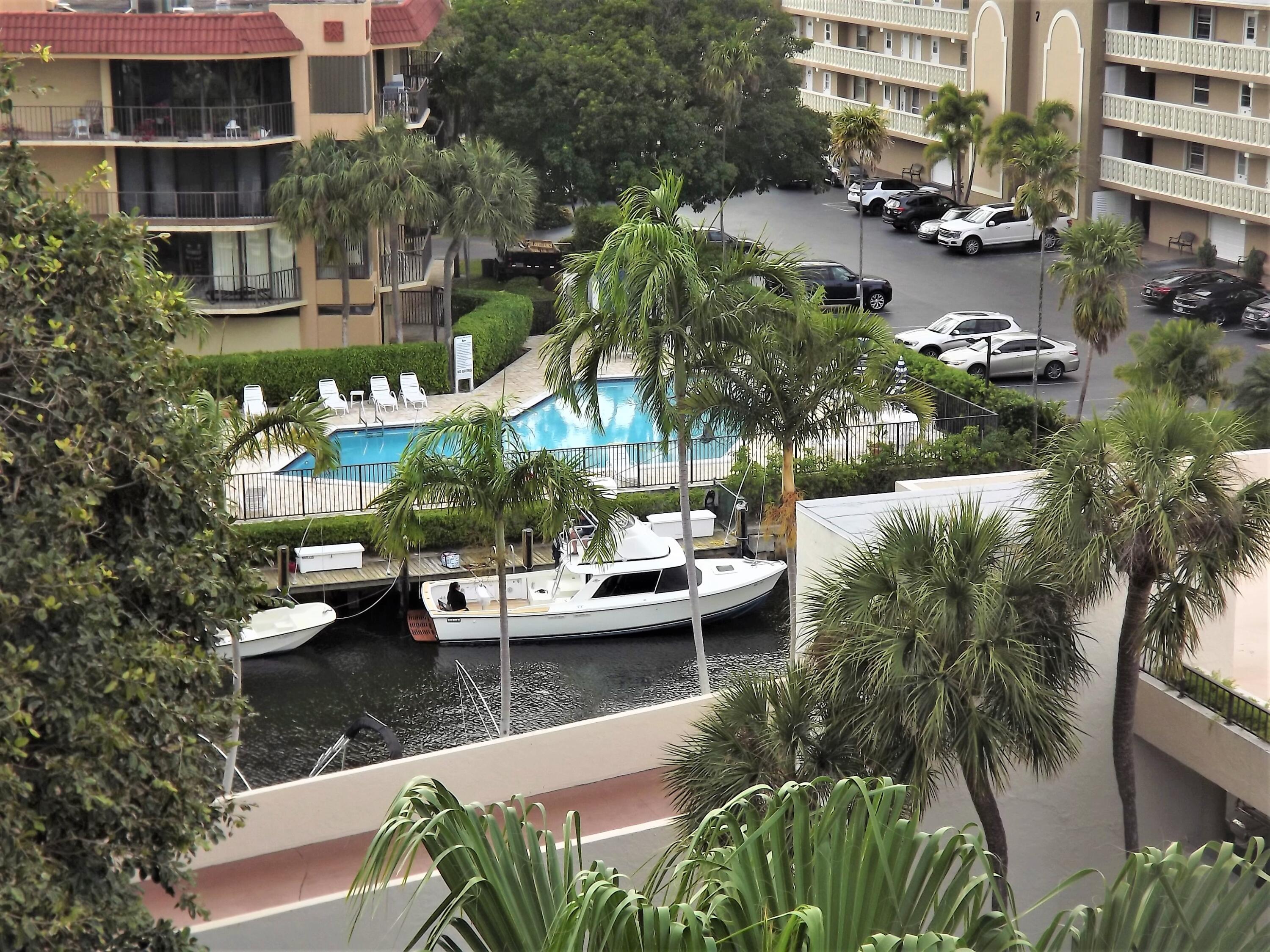 859 Jeffery Street, Unit 702 Boca Raton, FL 33487 - Photo 5 of 40 a view of swimming pool with outdoor seating