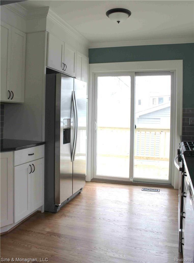 1527 Crooks Road Royal Oak, MI 48067 - Photo 13 of 19 Door wall access to deck and yard for easy outdoor dining