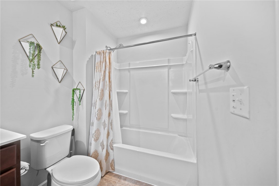 226 Golden Gate Avenue Springfield, OH 45506 - Photo 13 of 20 This bathroom features a sleek, modern design with a combined tub and shower unit.