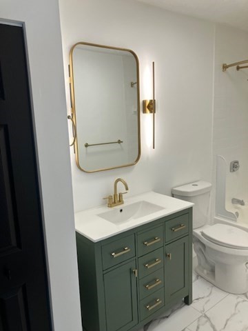 1000 Lexington Street, Unit 42 Waltham, MA 02451 - Photo 3 of 5 a bathroom with a toilet sink and mirror