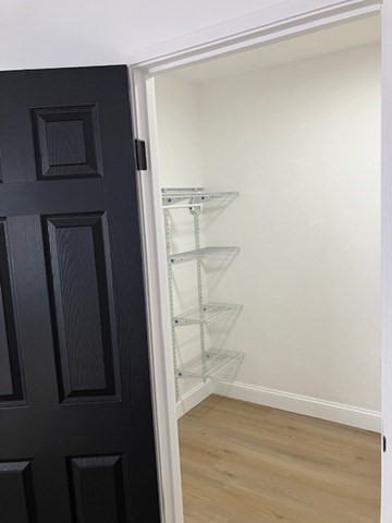1000 Lexington Street, Unit 42 Waltham, MA 02451 - Photo 5 of 5 a view of an empty walk in closet