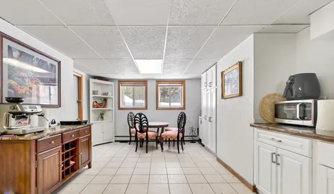 a room with furniture a flat screen tv and a window