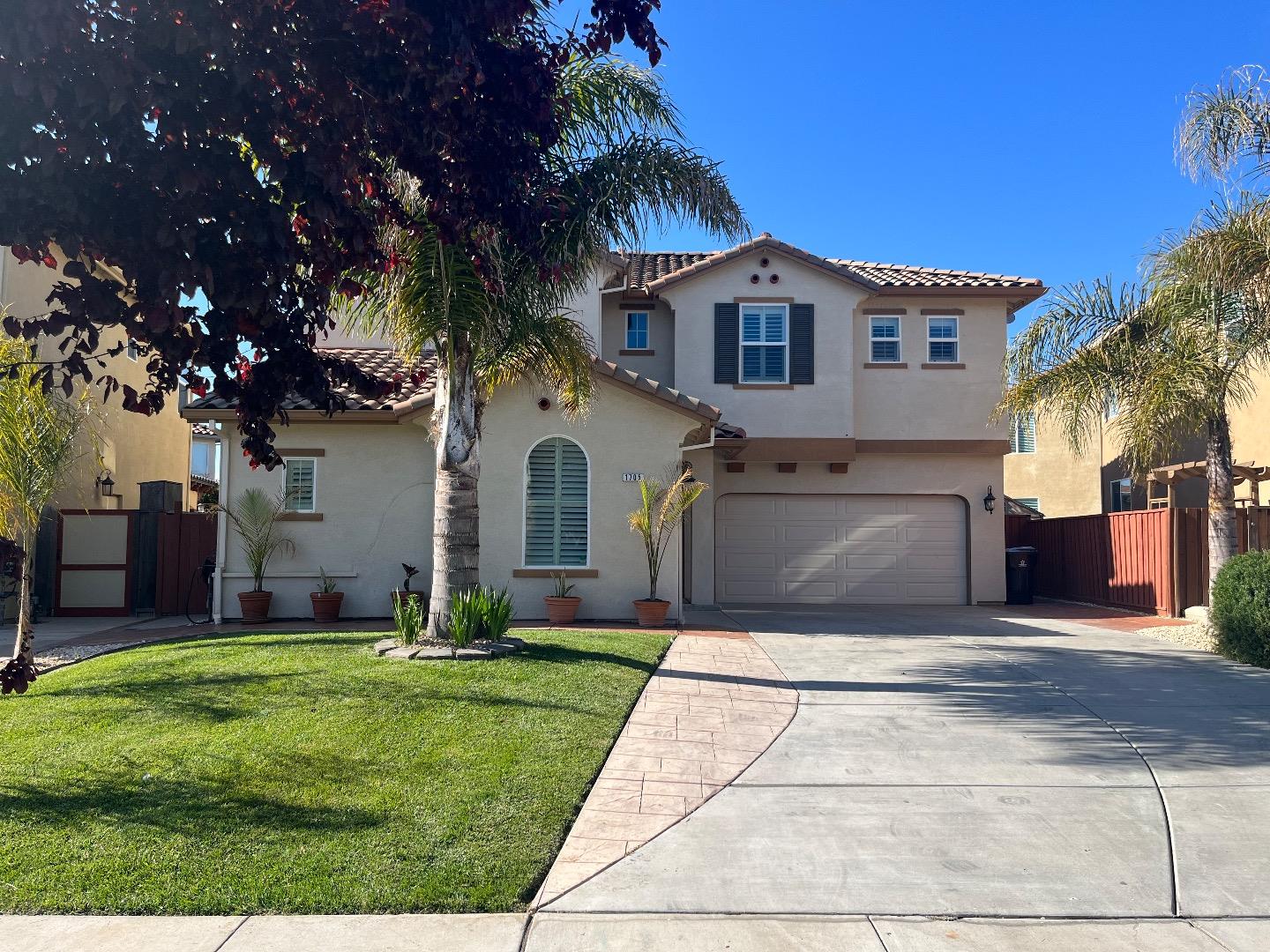 a view of house with yard and entertaining space