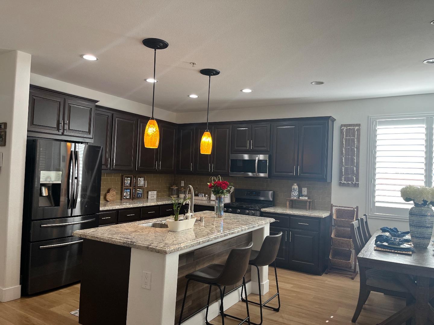 1705 Piazza Drive Salinas, CA 93905 - Photo 10 of 29 a kitchen with granite countertop a sink cabinets and stainless steel appliances