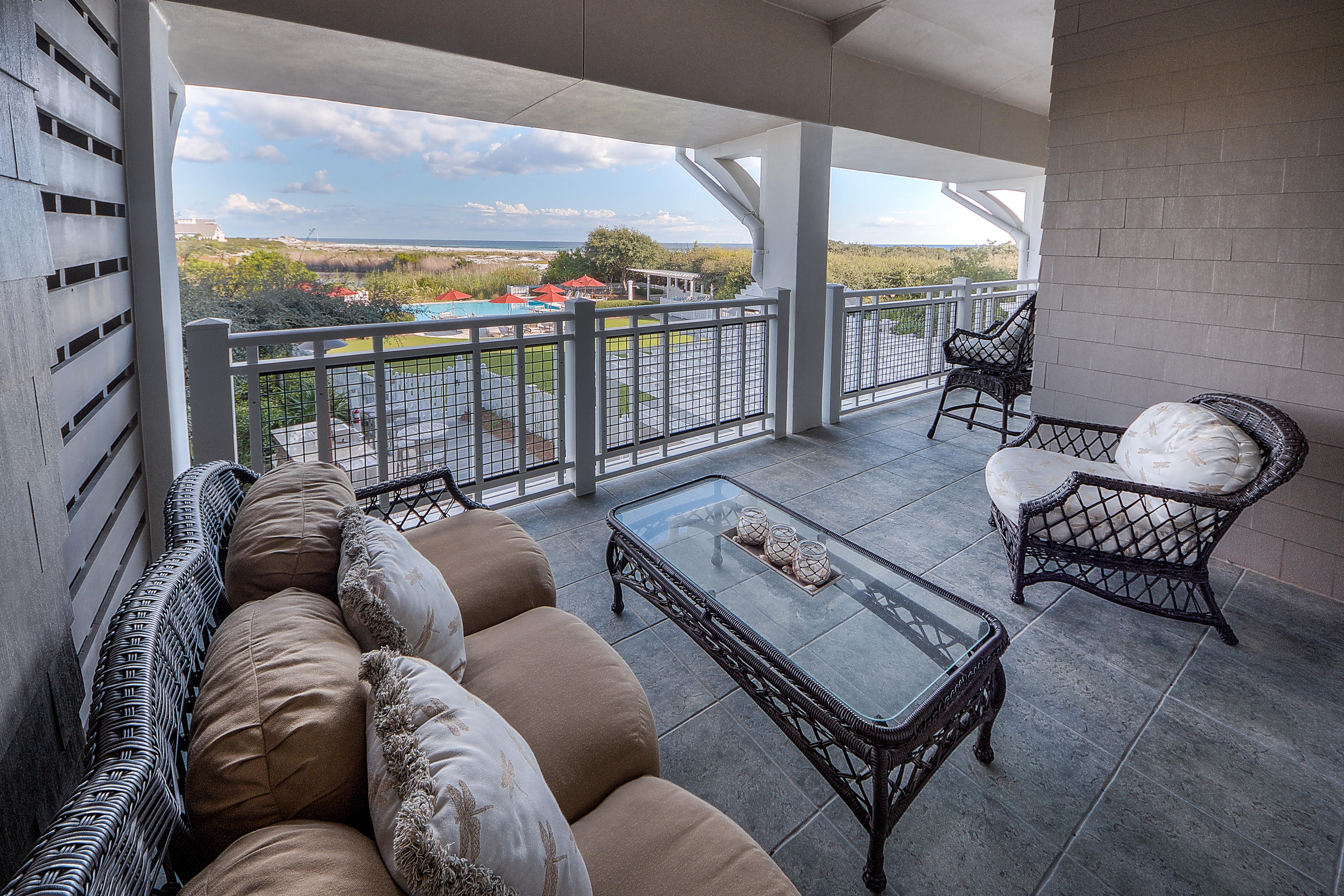 37 Compass Point Way, Unit 104 Watersound, FL 32461 - Photo 1 of 27 a living room with furniture and a floor to ceiling window