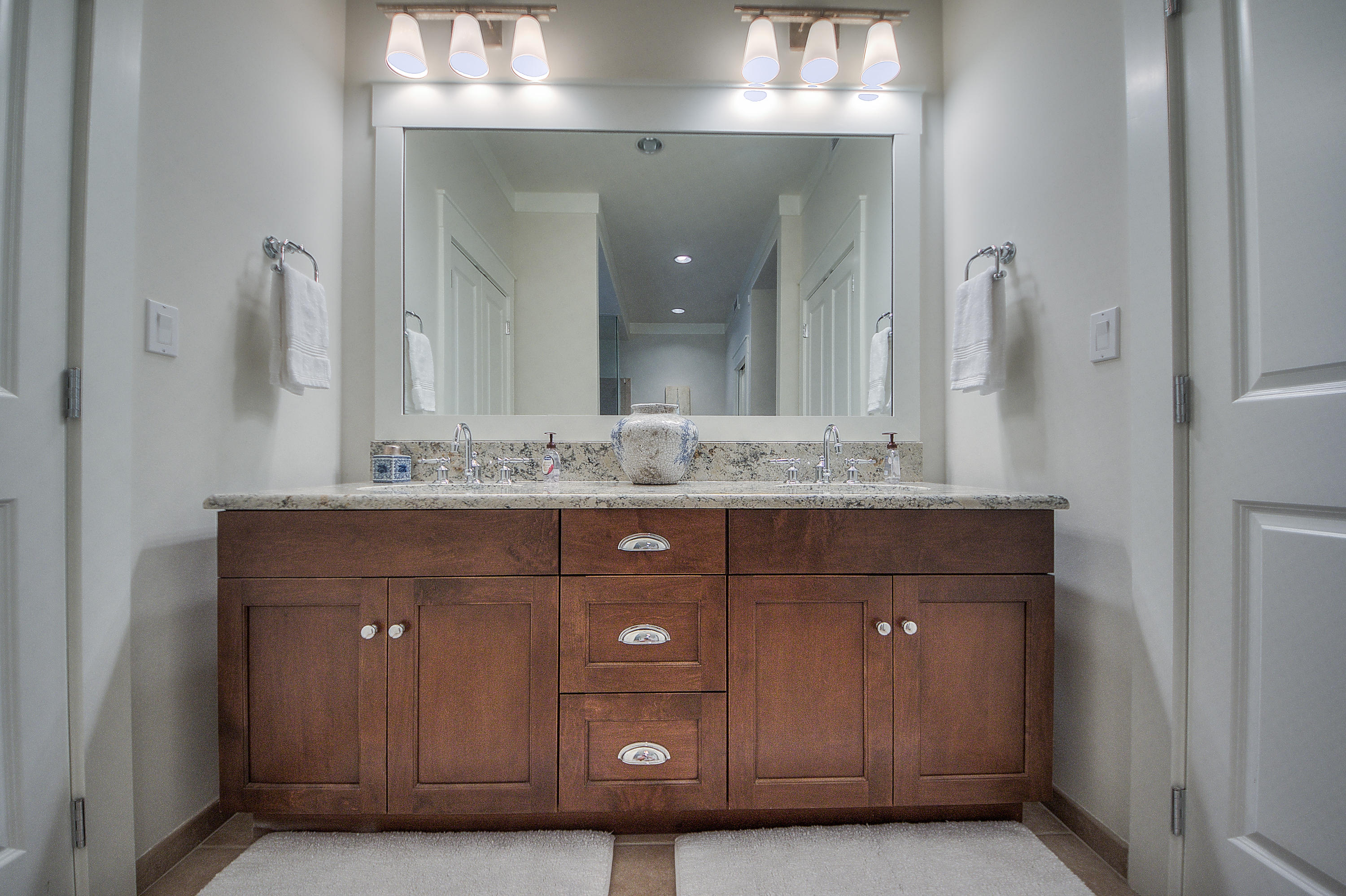 37 Compass Point Way, Unit 104 Watersound, FL 32461 - Photo 13 of 27 a bathroom with a sink vanity and a mirror