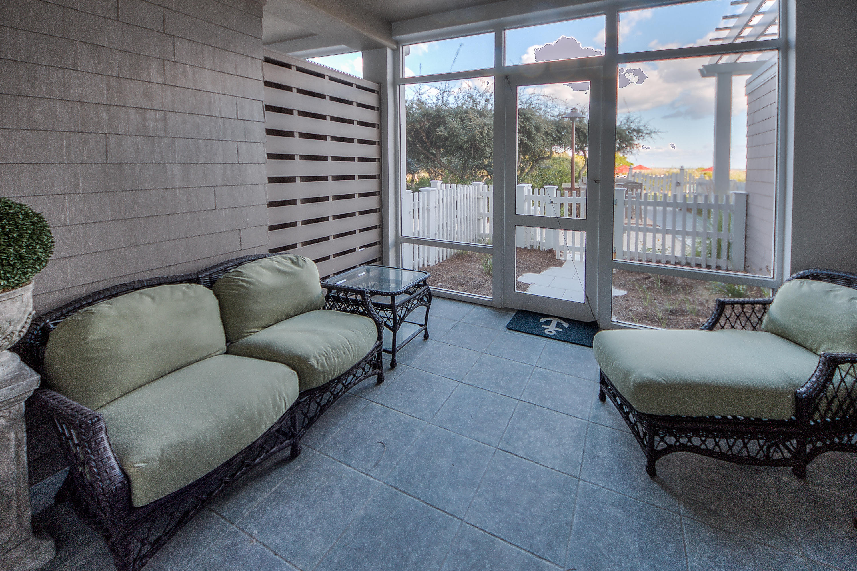 37 Compass Point Way, Unit 104 Watersound, FL 32461 - Photo 14 of 27 a living room with furniture and a large window