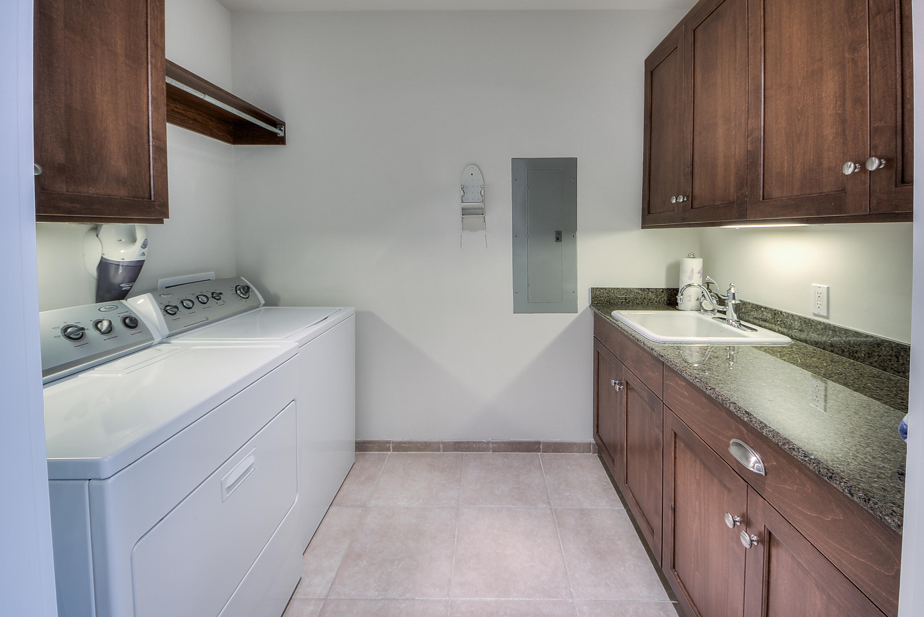 37 Compass Point Way, Unit 104 Watersound, FL 32461 - Photo 16 of 27 a utility room with sink dryer and washer