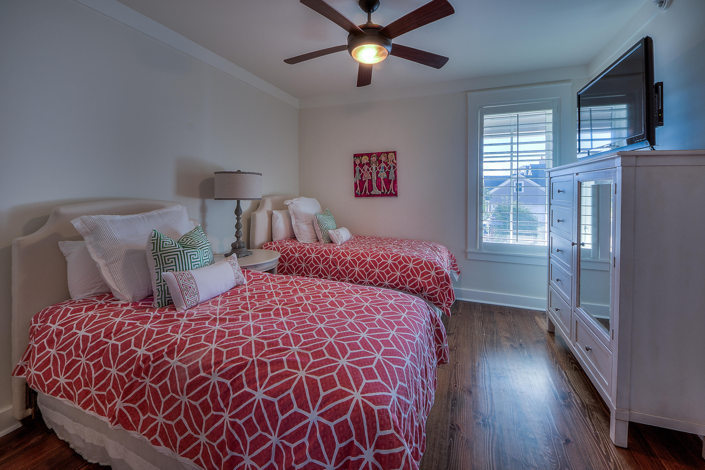 37 Compass Point Way, Unit 104 Watersound, FL 32461 - Photo 18 of 27 a bedroom with a bed and wooden floor