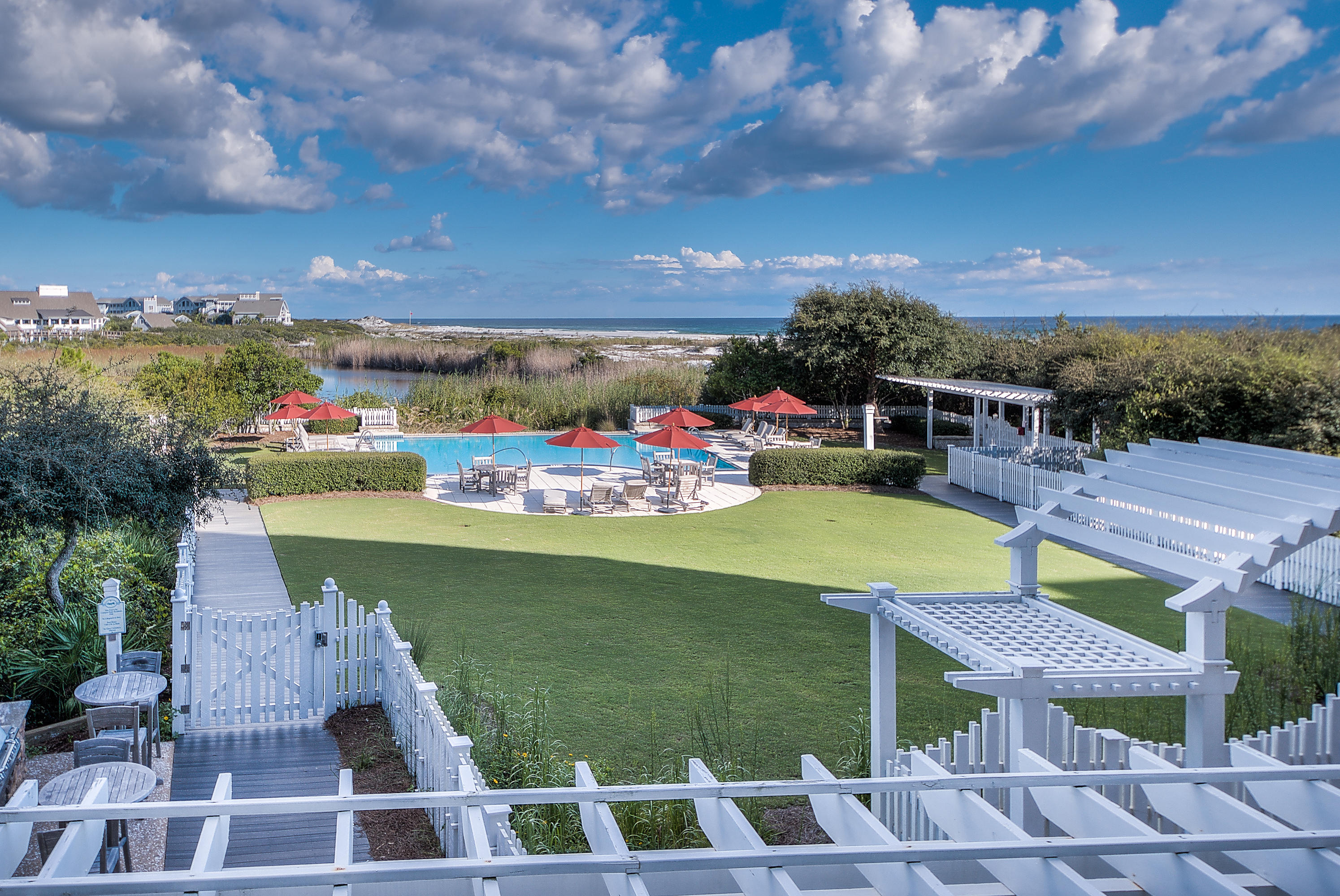 37 Compass Point Way, Unit 104 Watersound, FL 32461 - Photo 2 of 27 a view of a chairs and table on the terrace