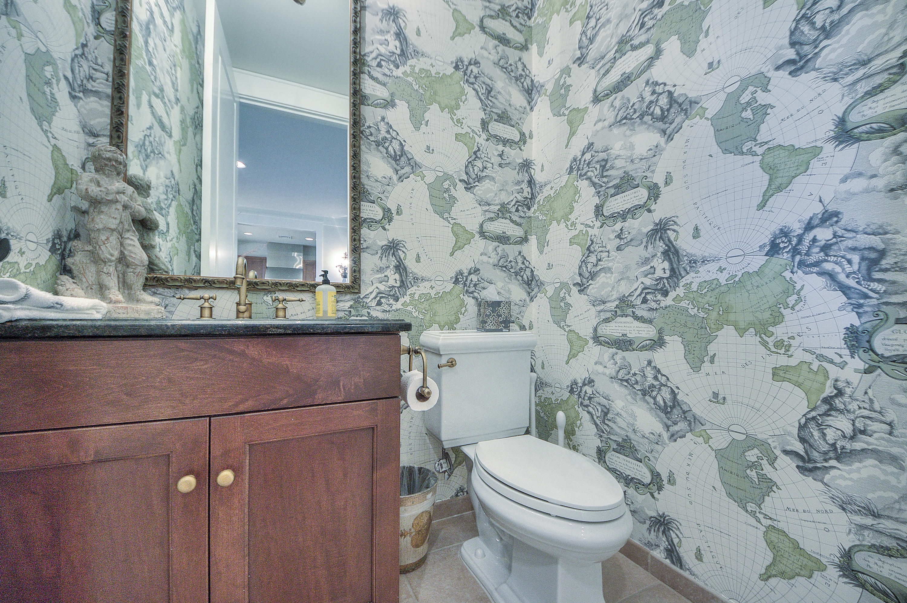 37 Compass Point Way, Unit 104 Watersound, FL 32461 - Photo 22 of 27 a bathroom with a granite countertop toilet and a sink