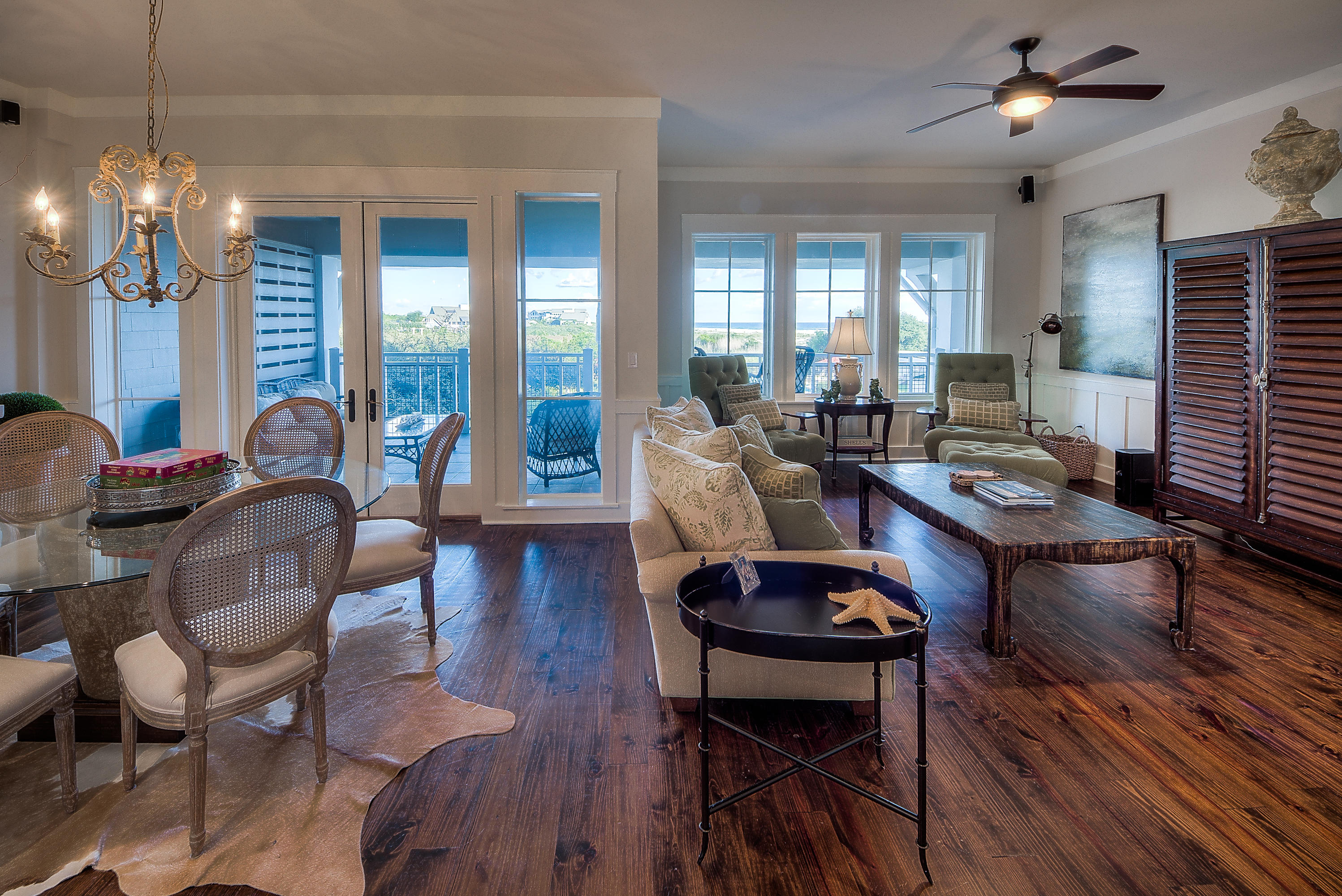 37 Compass Point Way, Unit 104 Watersound, FL 32461 - Photo 6 of 27 a living room with furniture a chandelier and a table