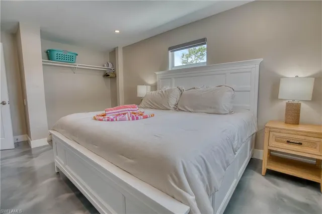 a bedroom with a bed and a walk in closet