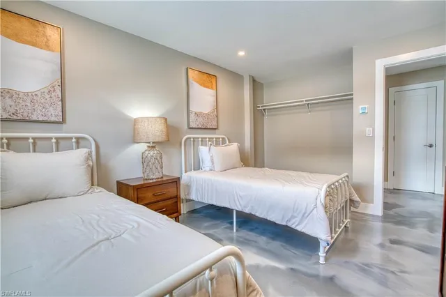 a bedroom with a bed and a mirror