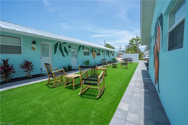 a view of a backyard with sitting area