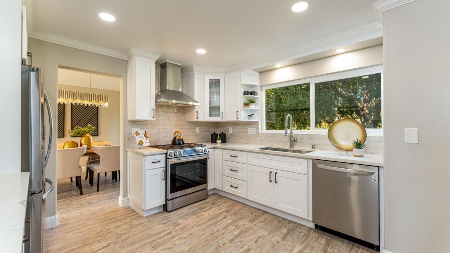 3253 Cheryl Circle Pleasanton, CA 94588 - Photo 11 of 37 a kitchen with a sink cabinets and stainless steel appliances