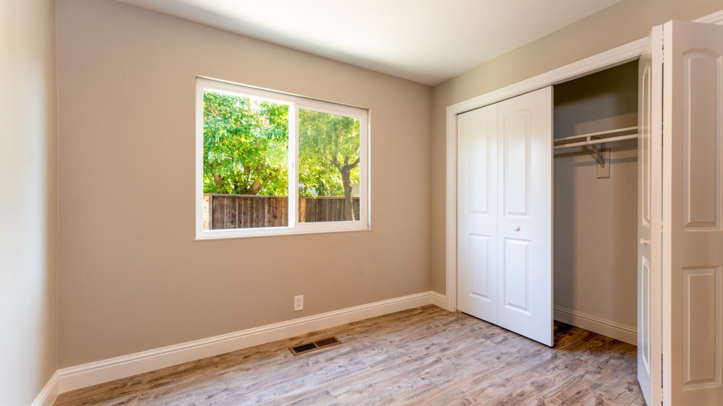 3253 Cheryl Circle Pleasanton, CA 94588 - Photo 14 of 37 a view of an empty room with wooden floor and a window