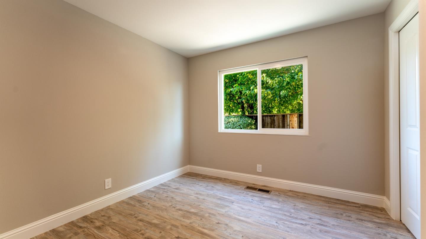 3253 Cheryl Circle Pleasanton, CA 94588 - Photo 15 of 37 a view of an empty room with wooden floor and a window