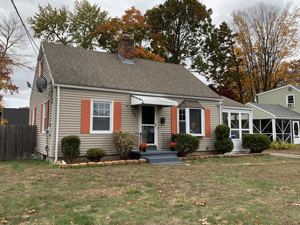 154 Mayflower Road Springfield, MA 01118 - Photo 1 of 15 a front view of a house with garden