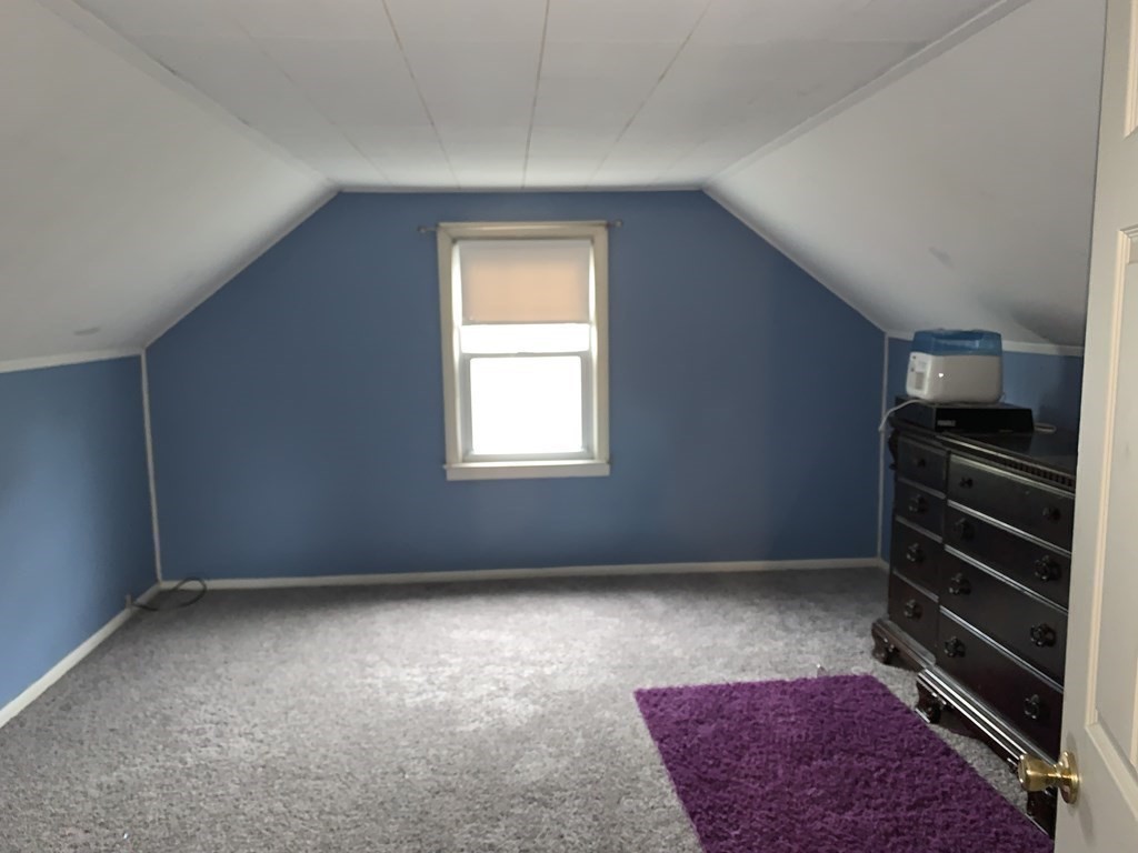154 Mayflower Road Springfield, MA 01118 - Photo 11 of 15 a view of an empty room with a staircase