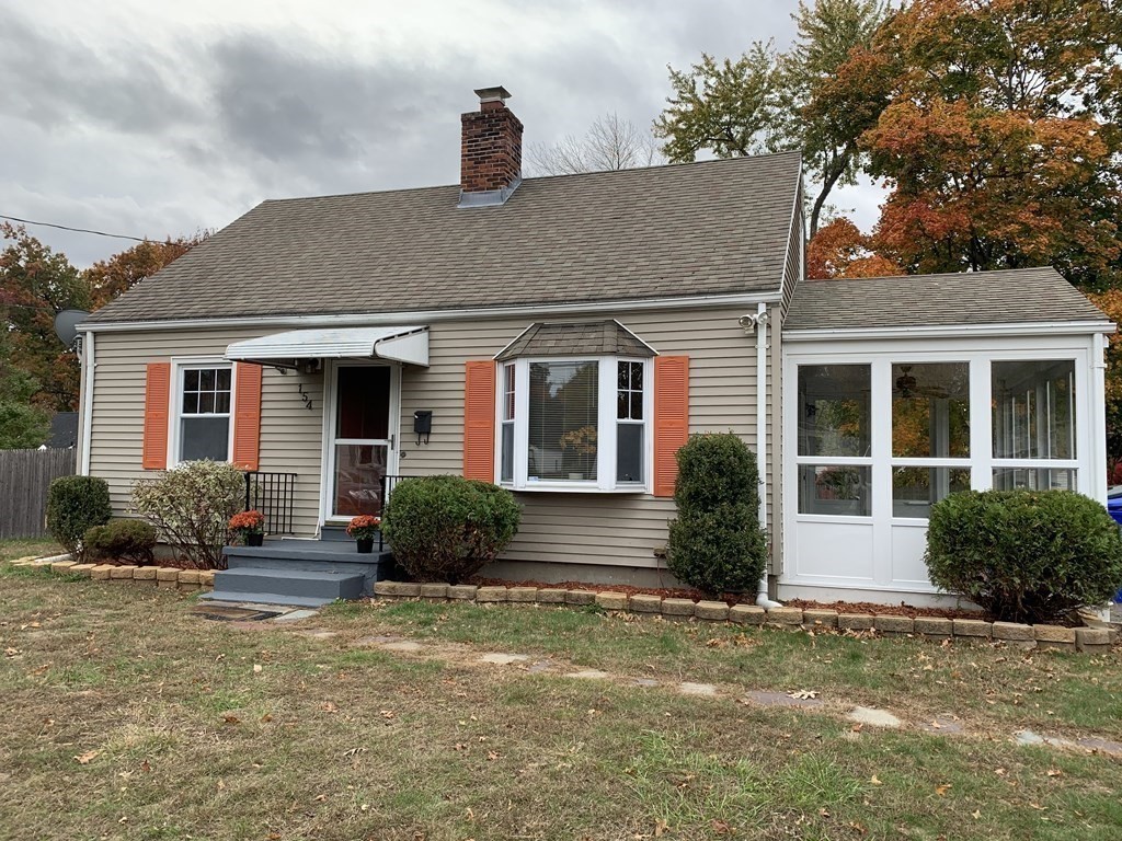 154 Mayflower Road Springfield, MA 01118 - Photo 14 of 15 a front view of a house with garden