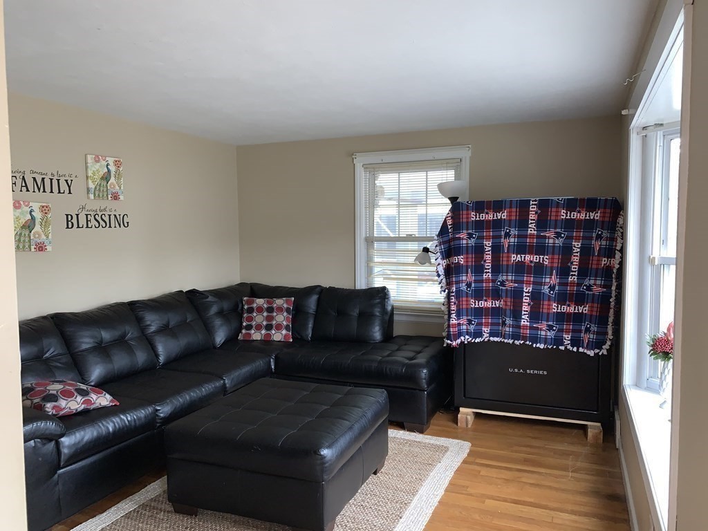 154 Mayflower Road Springfield, MA 01118 - Photo 5 of 15 a living room with furniture and a rug