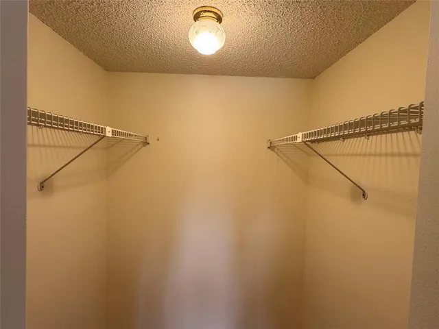 a bathroom with a toilet and a bath tub