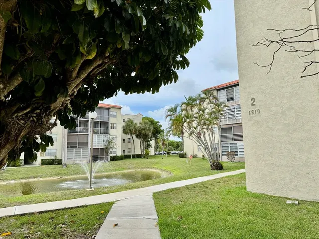 an outdoor space with furniture and umbrella