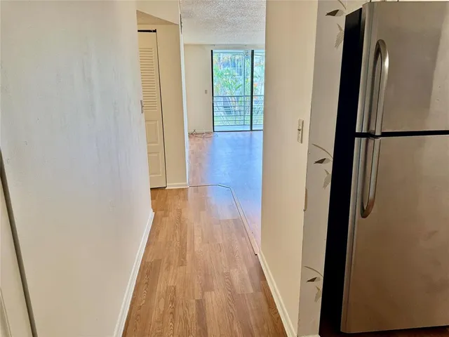 a white refrigerator freezer sitting inside of a kitchen
