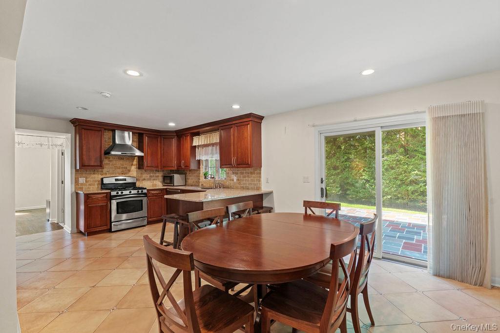 60 Plymouth Road Great Neck, NY 11023 - Photo 13 of 36 Dining space with light tile patterned floors and recessed lighting