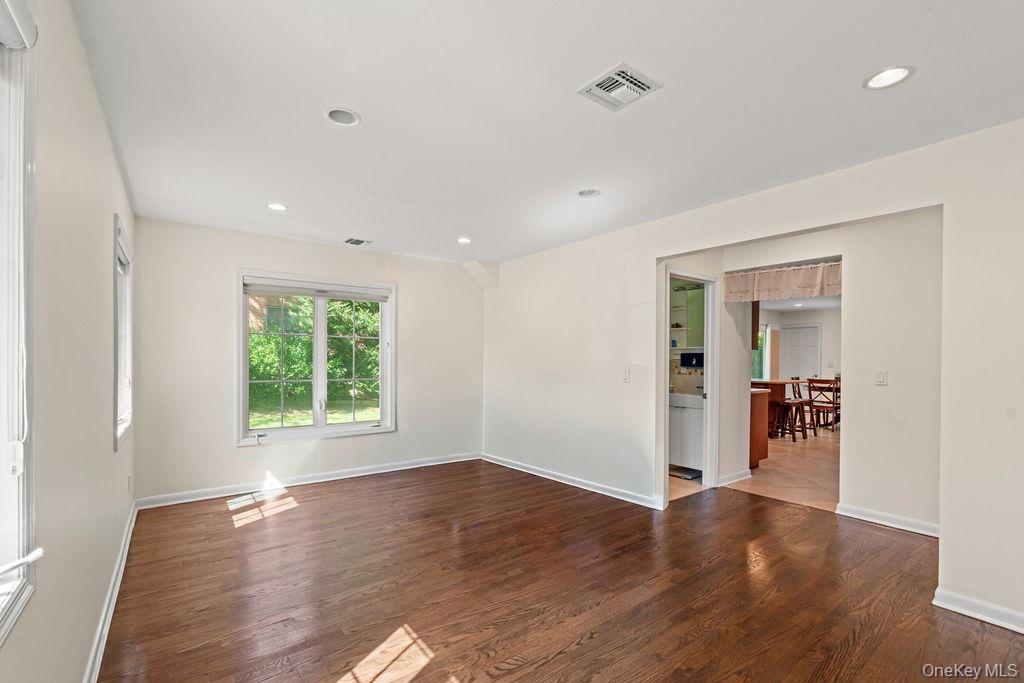 60 Plymouth Road Great Neck, NY 11023 - Photo 16 of 36 Empty room with wood finished floors and recessed lighting