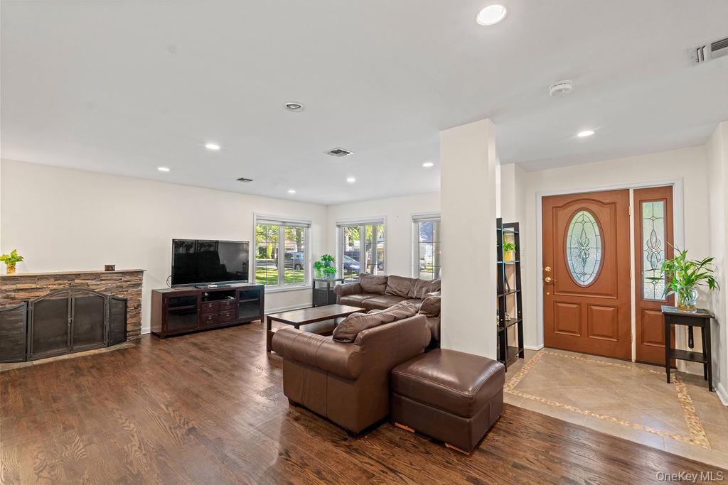 60 Plymouth Road Great Neck, NY 11023 - Photo 19 of 36 Living area featuring recessed lighting and dark wood-type flooring