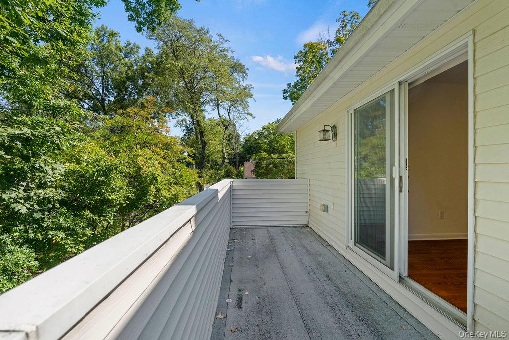 60 Plymouth Road Great Neck, NY 11023 - Photo 29 of 36 Deck with view of scattered trees