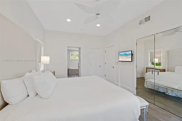 a bedroom with a bed and a lamp