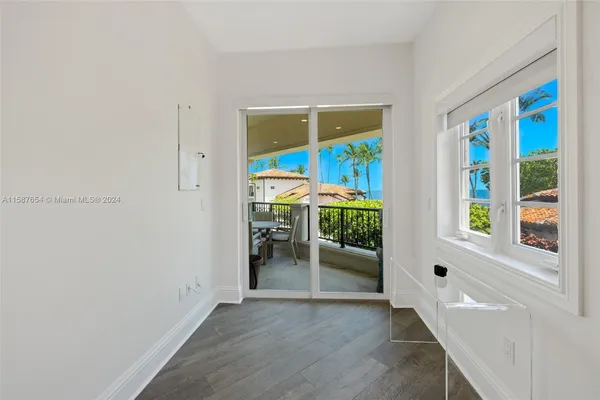 an entryway and livingroom with furniture