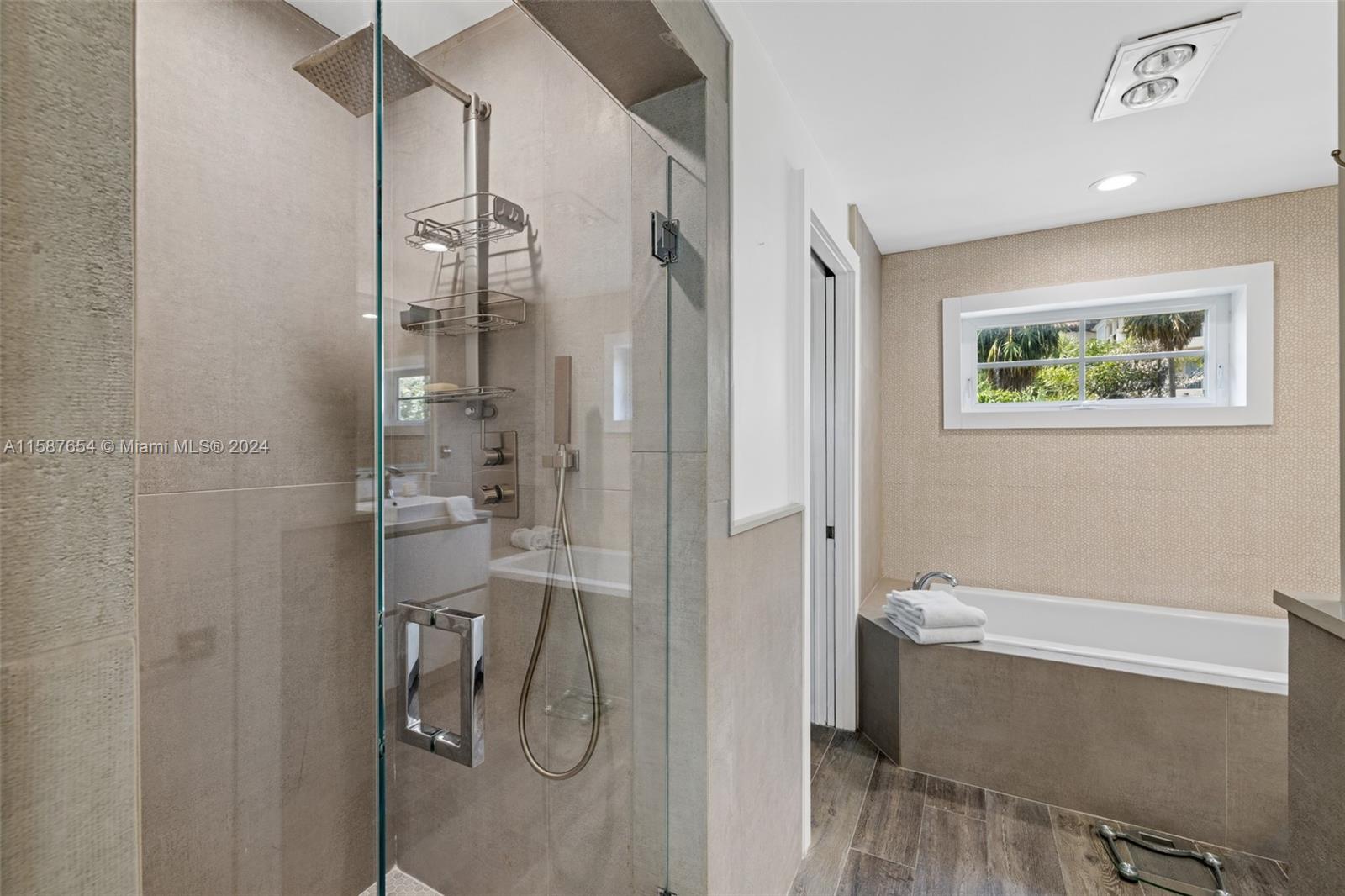 15122 Fisher Island Drive, Unit 15122 Miami Beach, FL 33109 - Photo 15 of 55 a bathroom with a bathtub and a shower