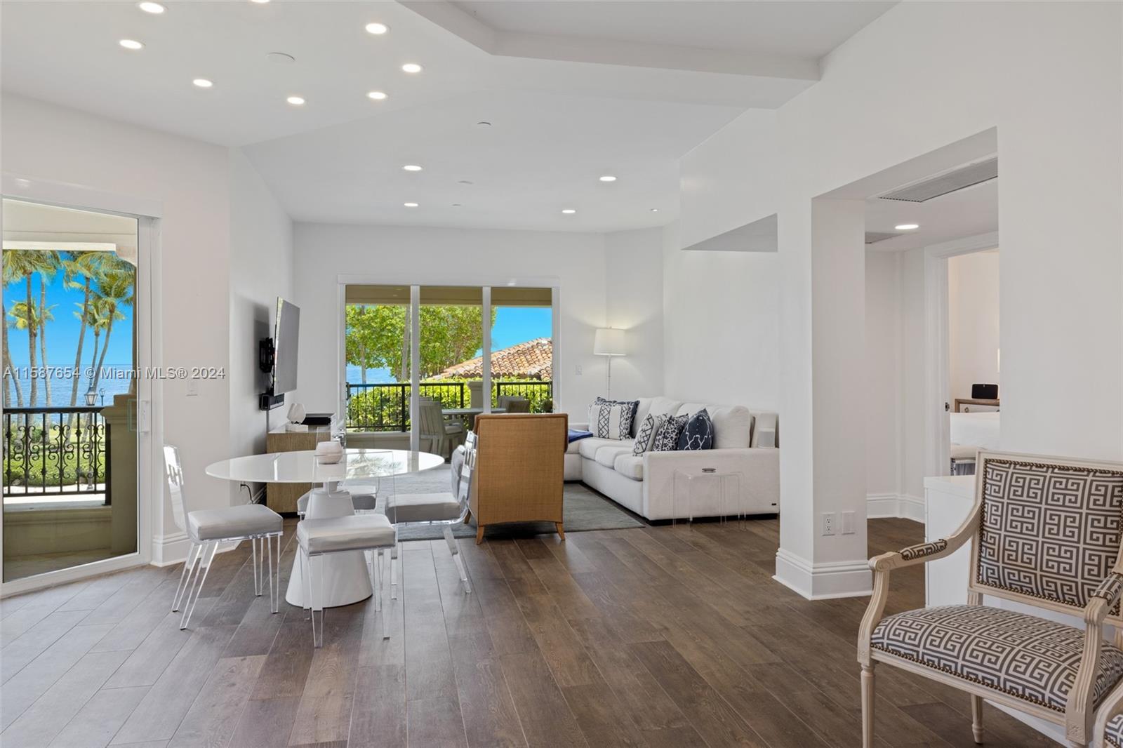 15122 Fisher Island Drive, Unit 15122 Miami Beach, FL 33109 - Photo 2 of 55 a living room with furniture and a large window