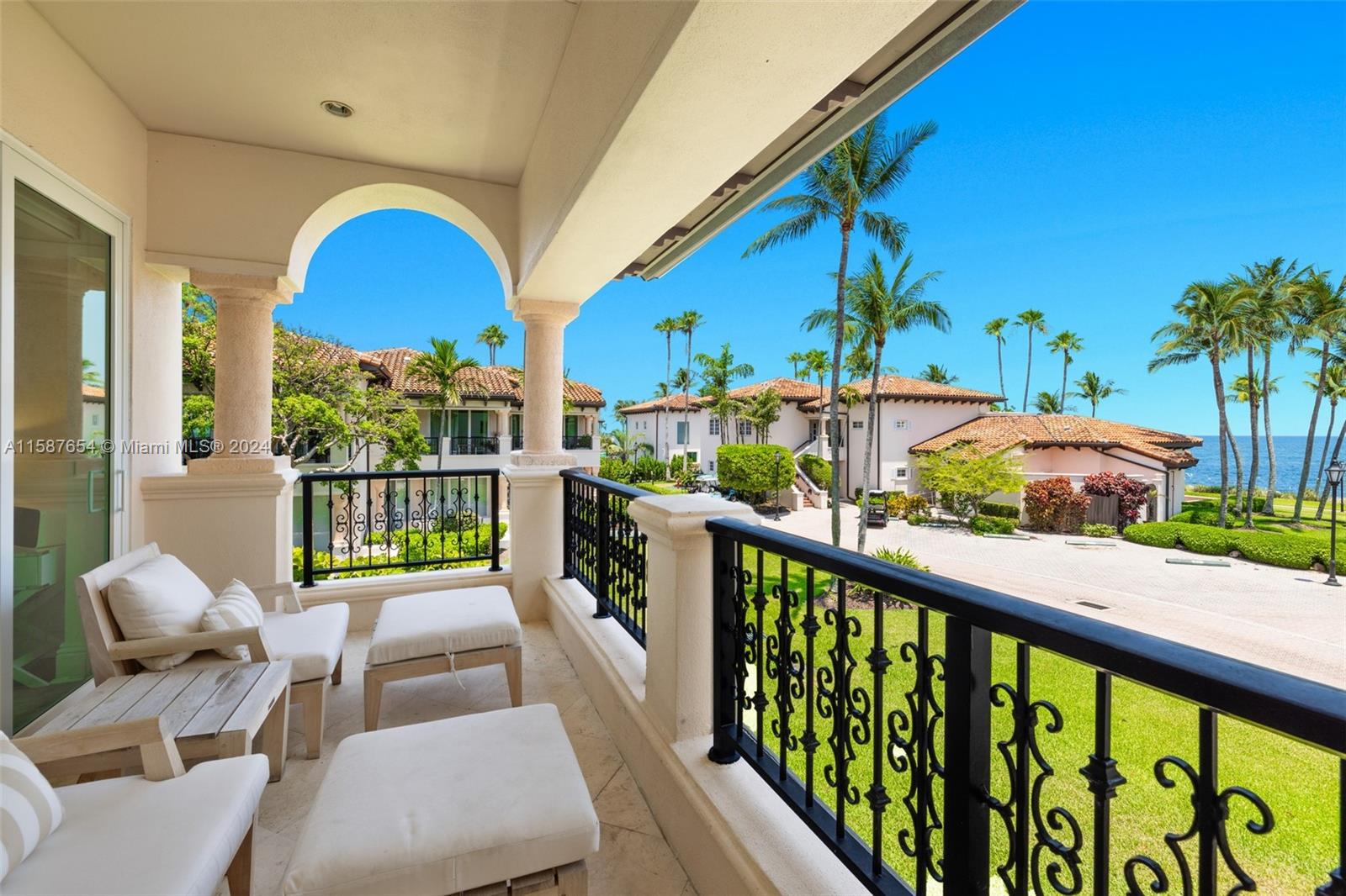 15122 Fisher Island Drive, Unit 15122 Miami Beach, FL 33109 - Photo 24 of 55 a view of a balcony with furniture