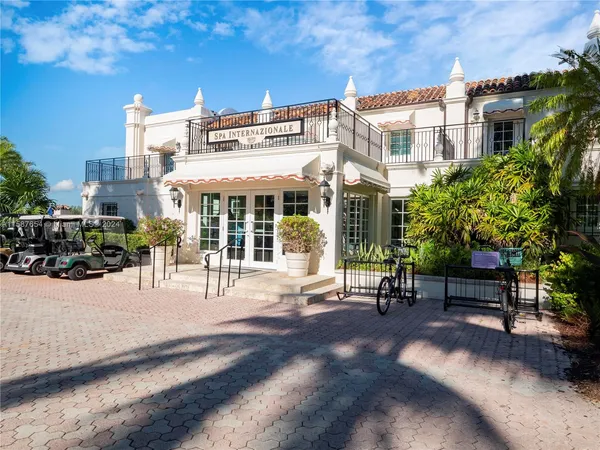 a picture of houses with outdoor space and lake view