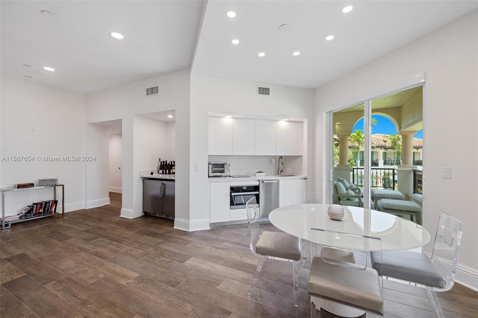 15122 Fisher Island Drive, Unit 15122 Miami Beach, FL 33109 - Photo 4 of 55 a living room with fireplace furniture and a large window