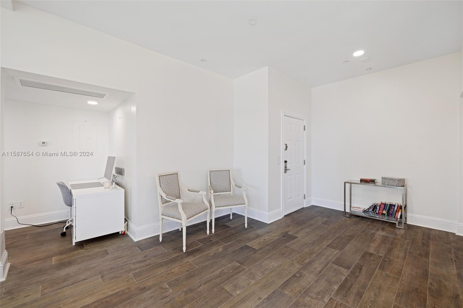 15122 Fisher Island Drive, Unit 15122 Miami Beach, FL 33109 - Photo 8 of 55 a view of a workspace with furniture and wooden floor