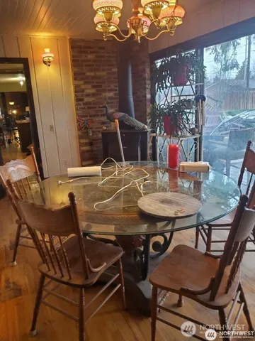 a view of a dining room with furniture and window