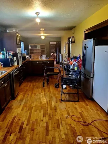 a room with gym equipment and a table