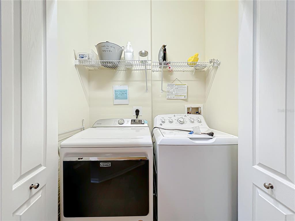 802 Brunello Drive Davenport, FL 33897 - Photo 26 of 36 a utility room with dryer and washer